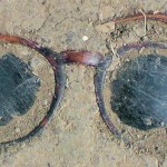 Here's looking at you - sunglasses in dried mud