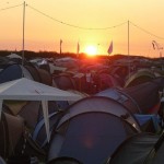 Sunset over a sea of tents.