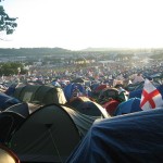 lots of tents with pyramid stage in the distance