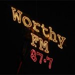 Worthy FM sign by night