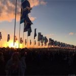 sunset behind the flags