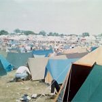 Camping in field overlooking main stage 